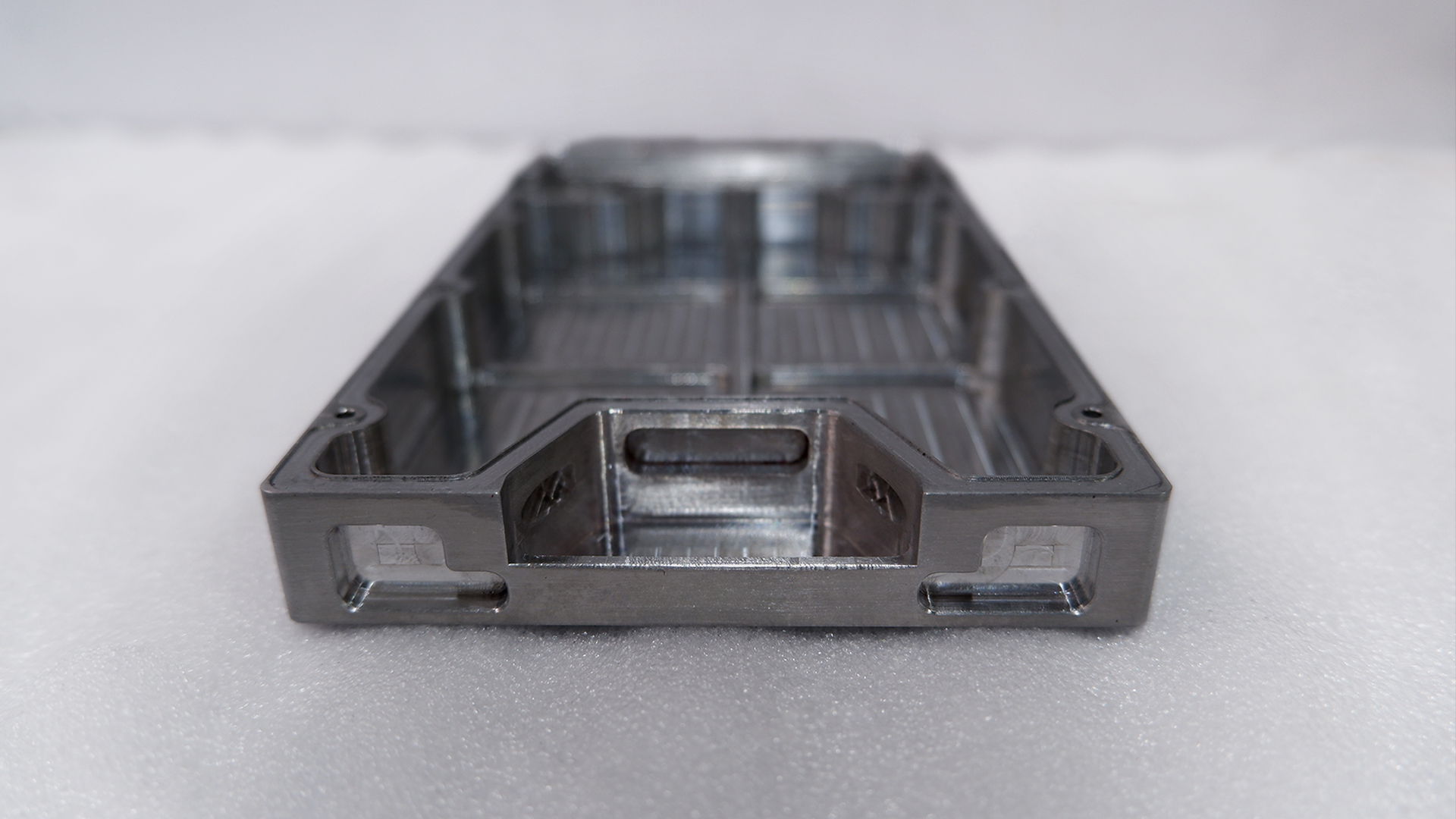 Machined aluminium aerospace housing with thin walls and pockets — Ethereal Machines